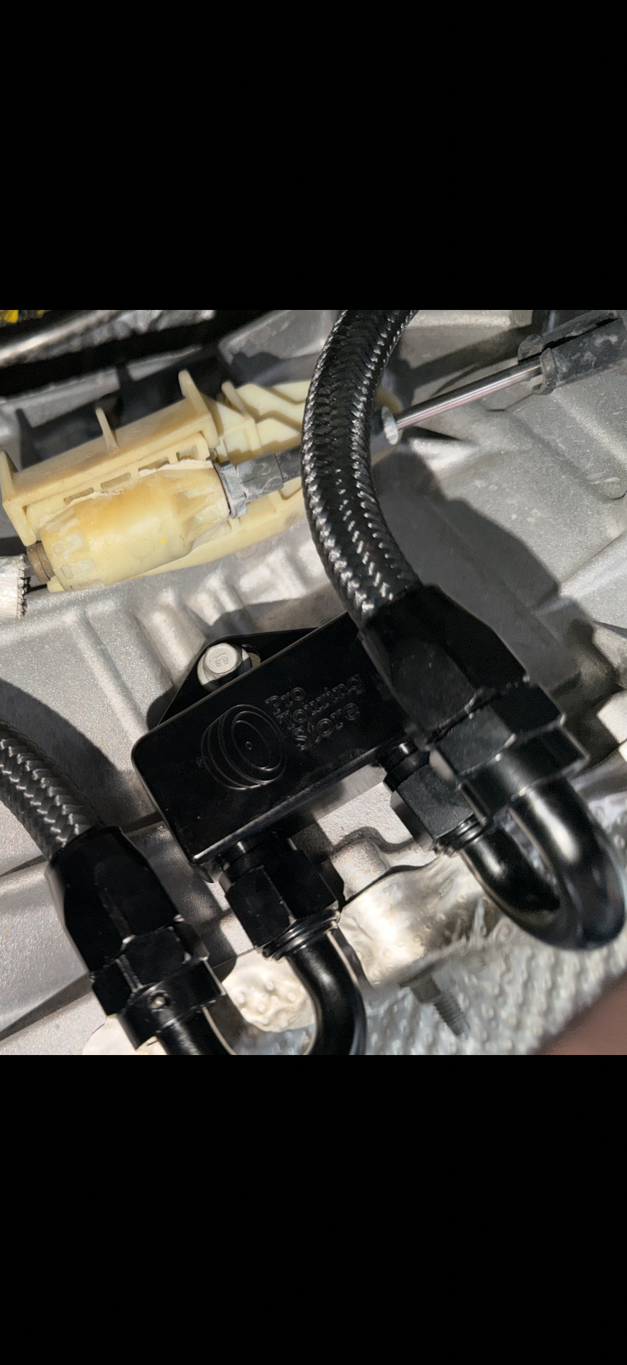 Transmission cooler installation on a Ford F-150 5.0 with 10R80 transmission